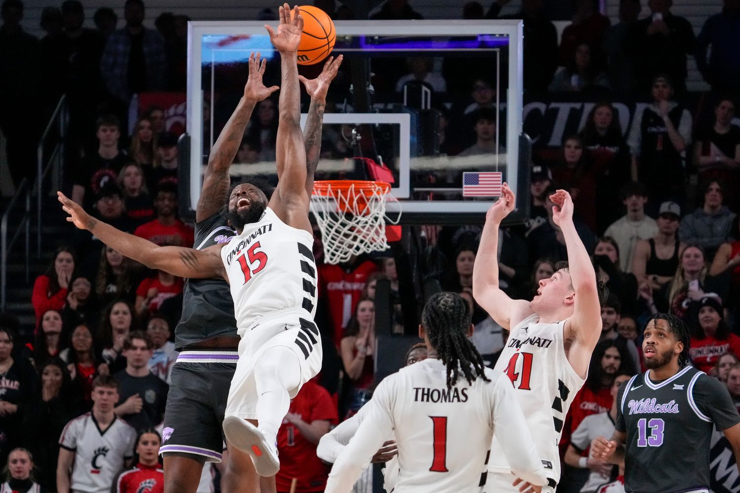  Cincinnati Bearcats forward John Newman III (15) breaks up a deep pass as time expires in the second half of the NCAA Big 12 basketball game between the Cincinnati Bearcats and the Kansas State Wildcats at Fifth Third Arena in Cincinnati on Saturday, March 2, 2024. The Bearcats collected a 74-72 conference win.